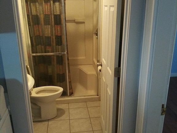 Bathroom has a stall ( no tub )