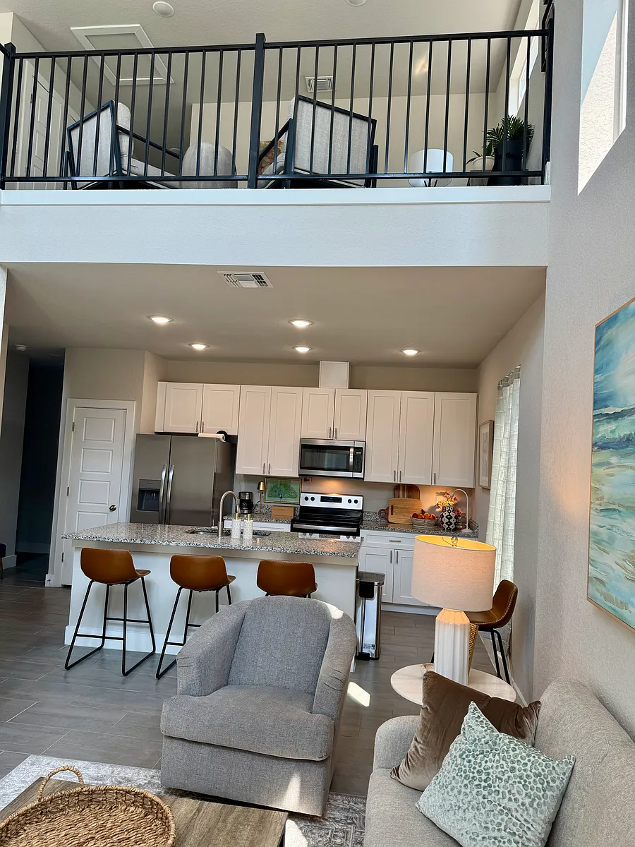 First floor kitchen with view to upstairs loft - 210 Rainbow Dr #8