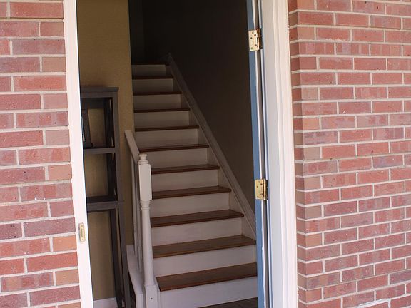 Front door access. Steps to 2nd floor shown. To the left is the main entry foyer.