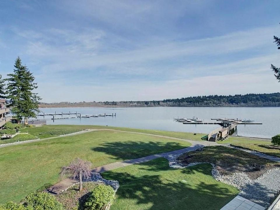 Private Lake Villas waterfront with lawn, firepit, & dock