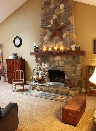 Dramatic stone fireplace in living room.