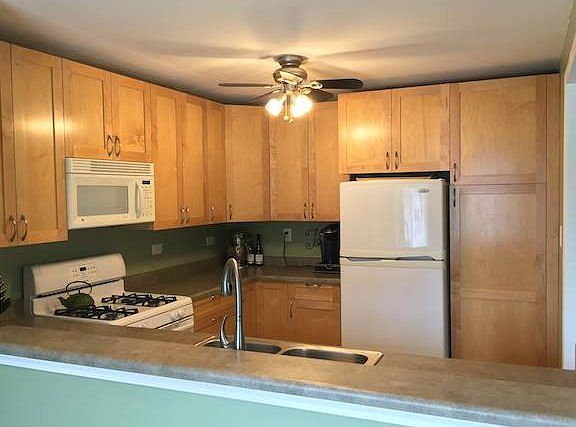 Kitchen, full height cupboards and pantry.