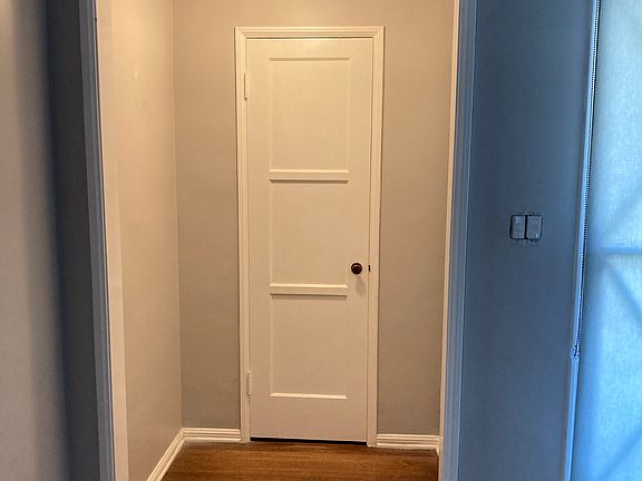 Front entry into living room. 
Coat closet