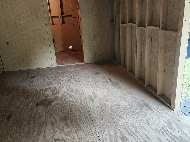 Back porch/ Storage room with Laundry hook up across thru door way.