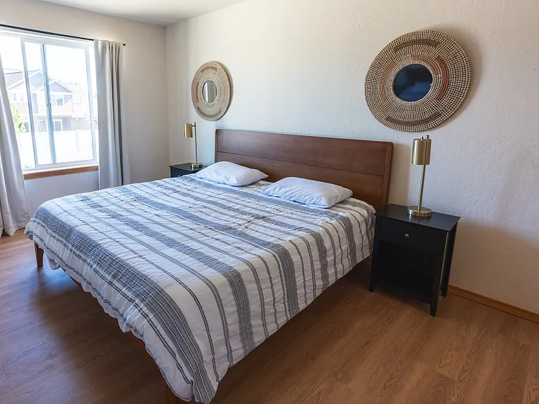 Main Bedroom - Spacious Walk in Closet with window. New KING memory foam mattress in 2026. View of Canfield Mountain.