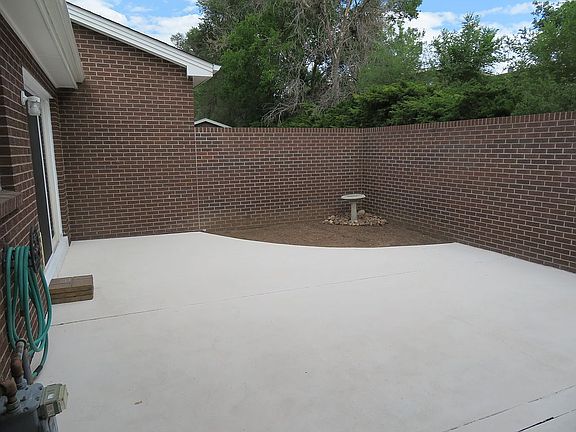 Patio with flower/garden bed