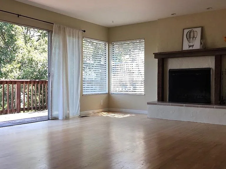 Huge living room that opens up to a deck. Lots off light and working fireplace