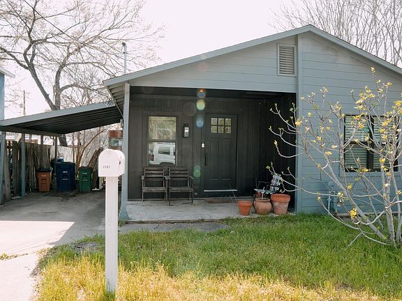 front of house + porch + carport