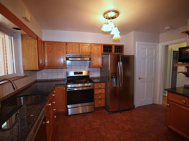 Newly remodeled kitchen with spacious counter tops and storage. Also features a new gas stove, new refrigerator with a filtration system.