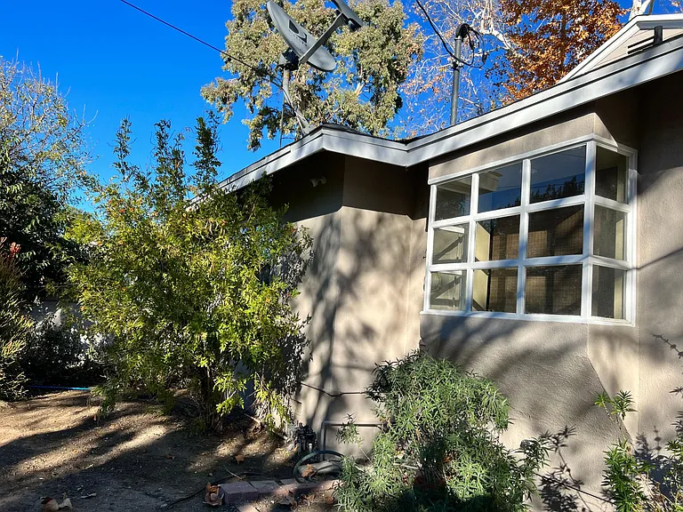 Rear view of kitchen bay window and garden