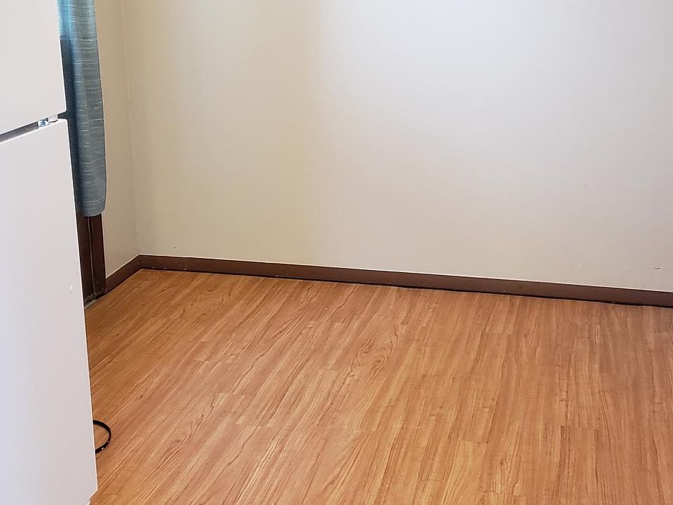 Plenty of room for a table and chairs and a kitchen cart.