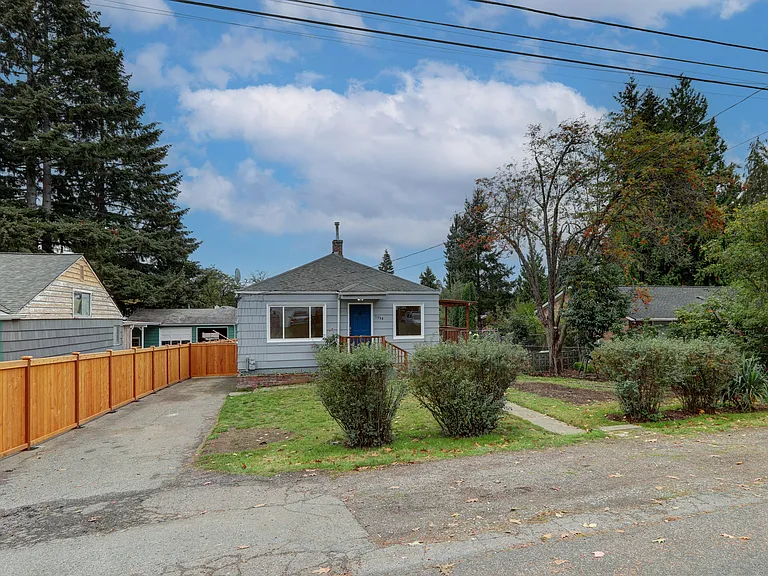 Front of the house. Long driveway leading to gated carport!