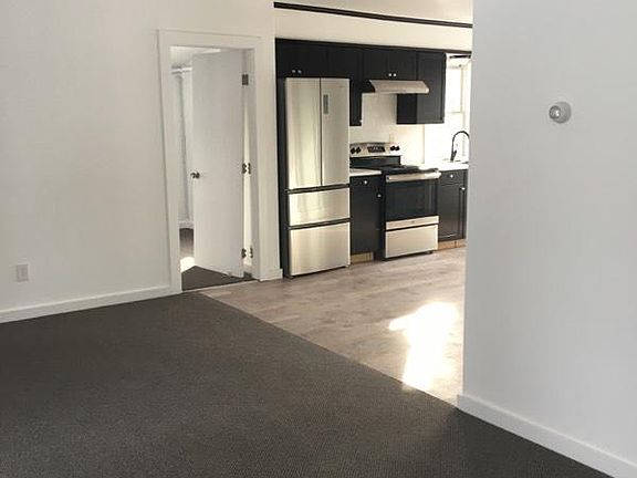 Living room looking into kitchen