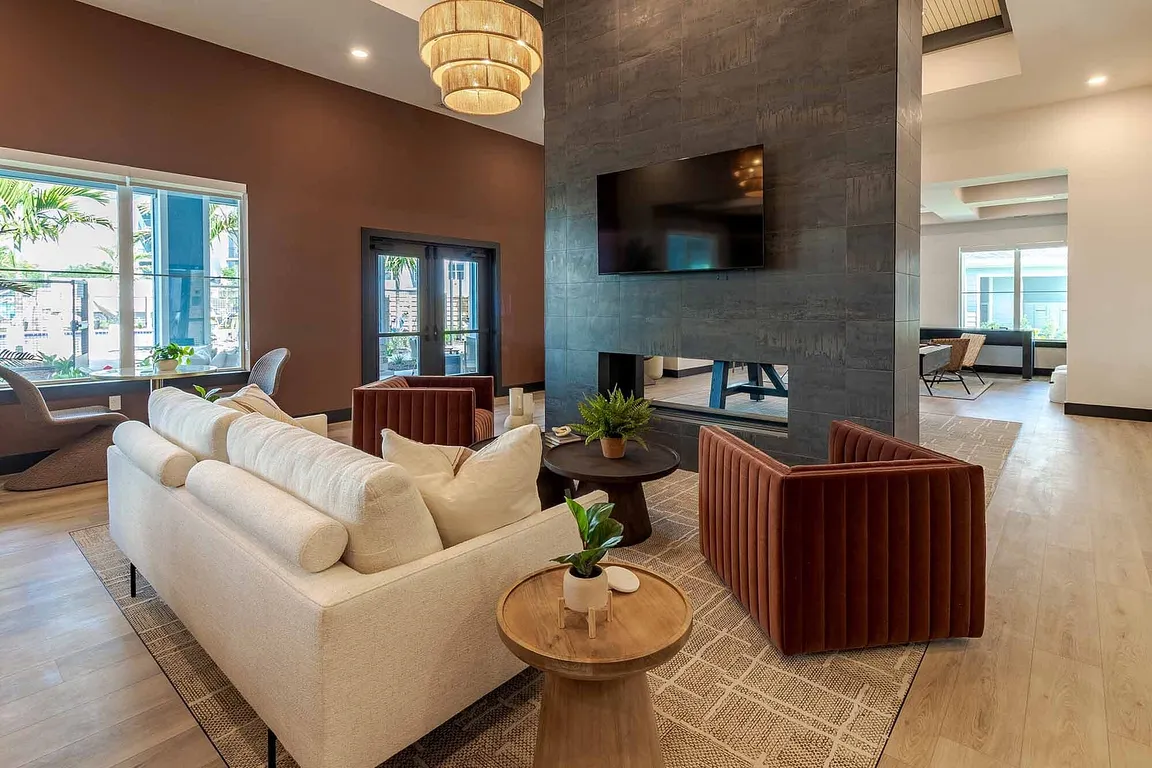 Gather around the dramatic double-sided fireplace in our open-concept clubhouse lounge, designed for comfort and connection year round.