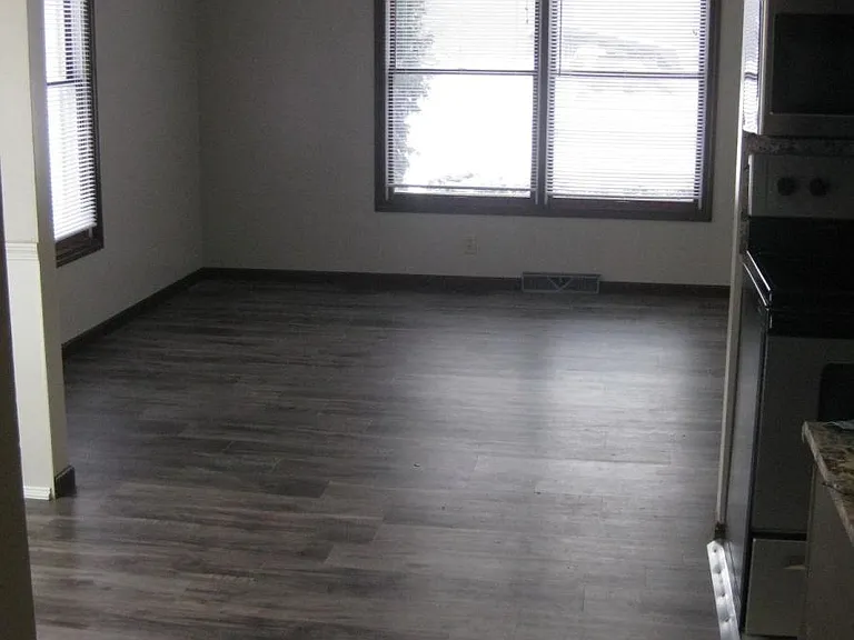 Sunny living room with two big windows