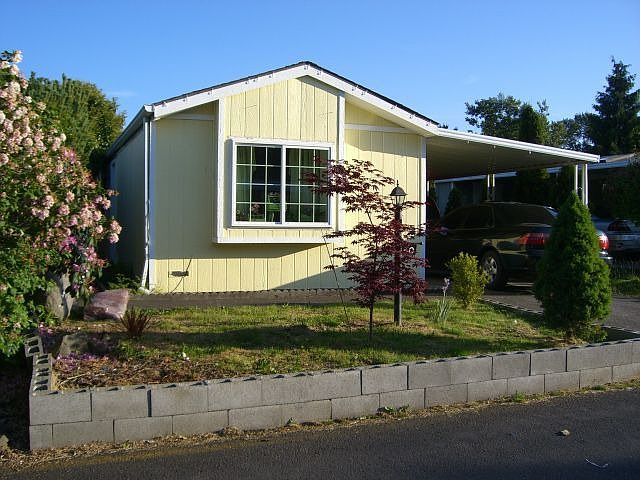 Home recently painted and has a nicely landscaped front yard.