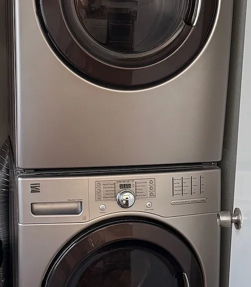 In unit washer and dryer, located just off of the kitchen area.