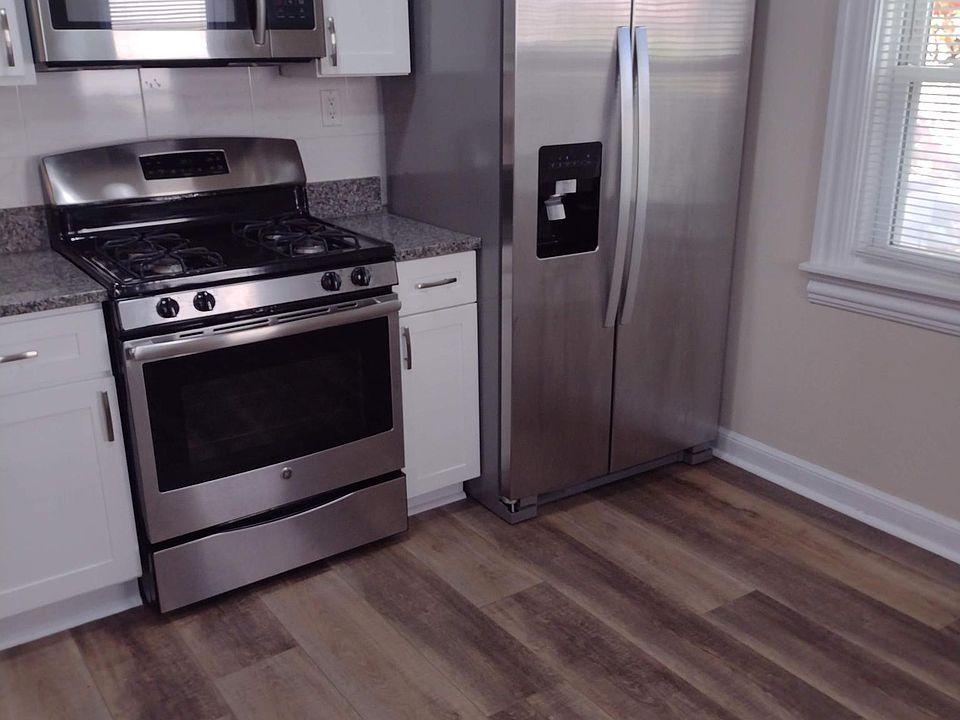 New kitchen. Stainless appliances. Luxury vinyl plank flooring