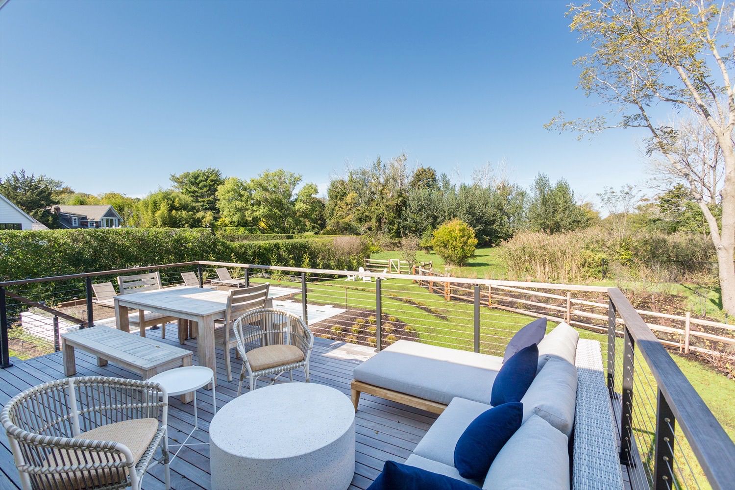  Pool deck with gas BBQ overlooks the backyard and pool with peak water views of the bay. 