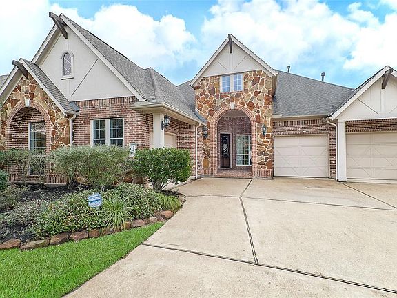 Massive covered front porch. Beautiful brick and stone elevation. Extensive parking!