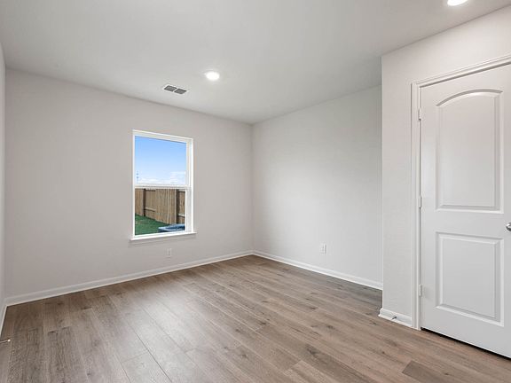 The dining room has a large window that lets in great natural light.