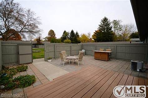 Private fenced patio with gate to large common area.