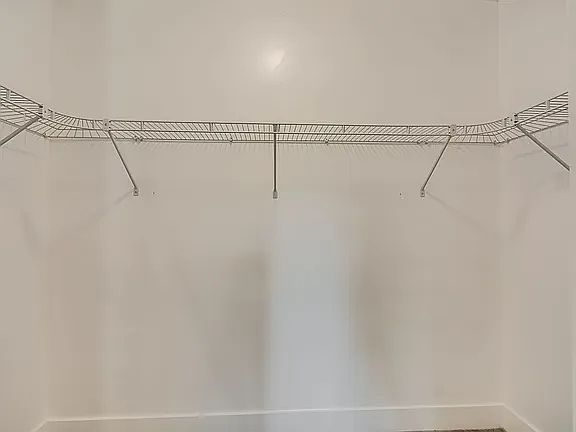 large walk-in closet master bedroom