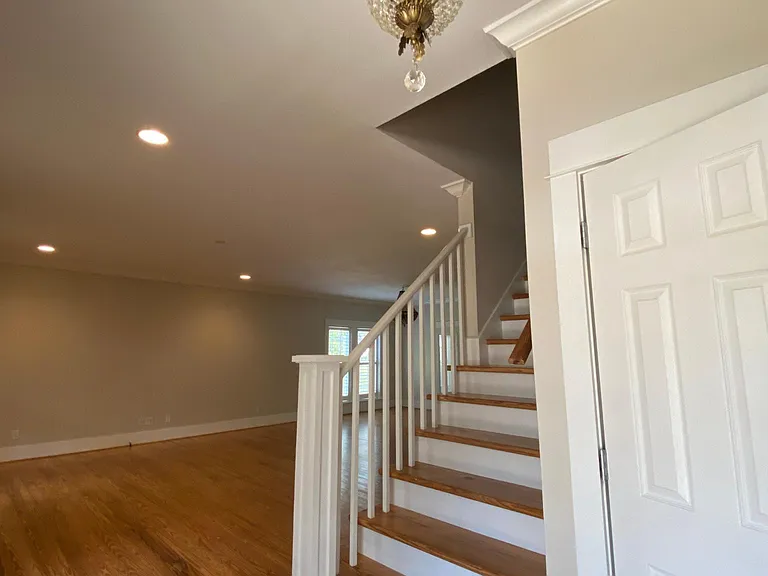 Entrance, living room to the left, stairs leading to two upstairs bedrooms and a bathroom. Closet to the right of the stairs, 1/2 bath located to the right of the entrance. Hardwood floors throughout.