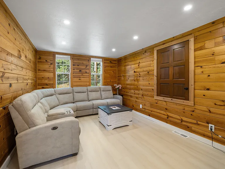 Upstairs entertainment are off primary suite. Couch pulls out to 6 lazyboy type chairs. Large screen TV.