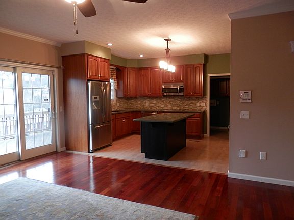 Den Opens to Kitchen