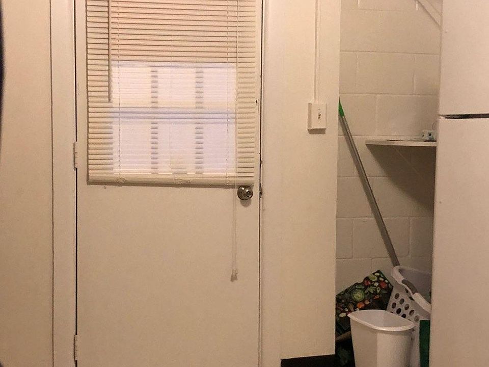 Front door in kitchen, second entrance in rear of unit.