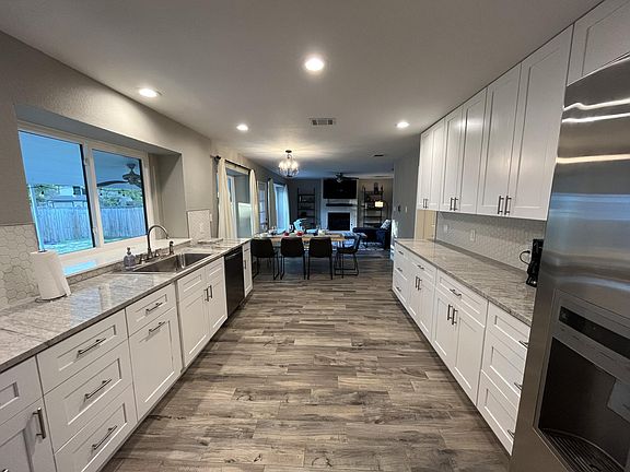 Beautiful large kitchen with new granite countertops and new stainless steel appliances. Super large pantry.