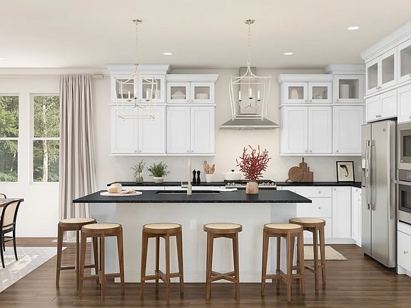 Kitchen with pendant lighting and glass upper cabinets