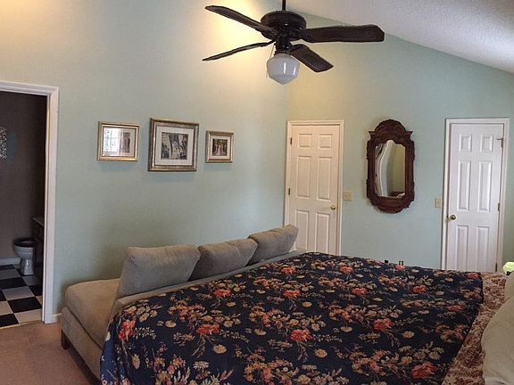 Master bedroom with vaulted ceiling & en suite