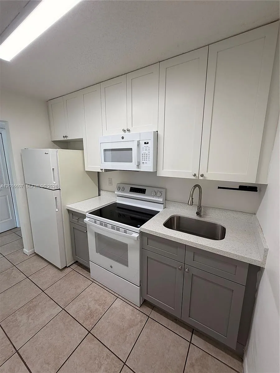 Building Photo - 6990 NW 186th St #4-210A