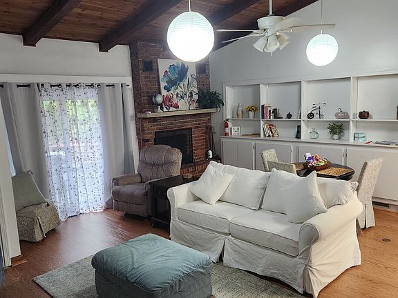 Livingroom with sleeper sofa, fireplace, and 55" TV basic streaming services included.