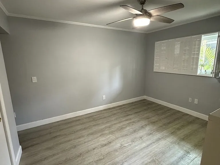 Empty Bedroom
Spacious bedroom with luxury vinyl plank flooring, ceiling fan, and plantation shutters _ light-filled and move-in ready