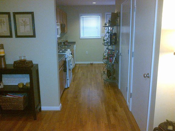 View from living room to kitchen which enables you to cook and entertain your guests at the same tim