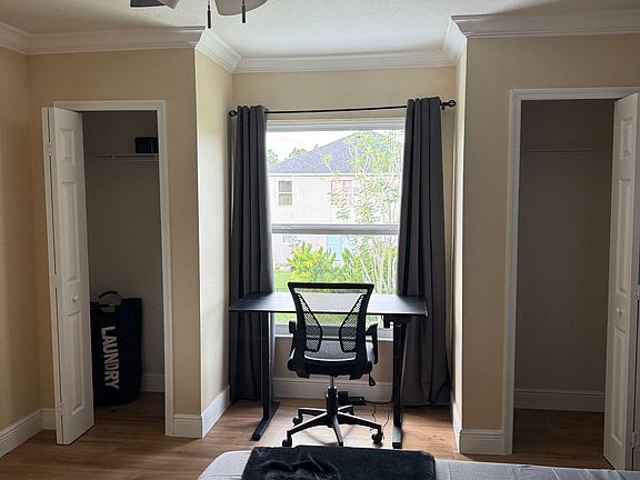 electric standing desk, ergonomic chair with power strip