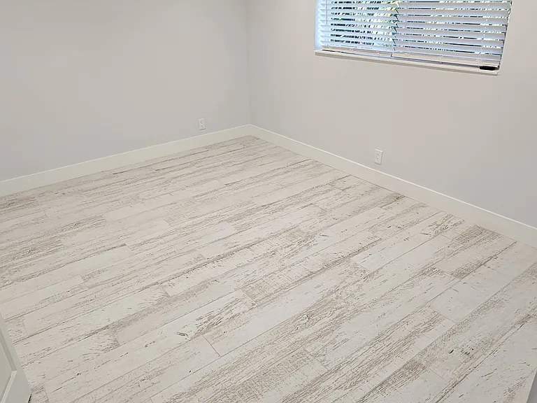 Louvered blinds provide privacy.