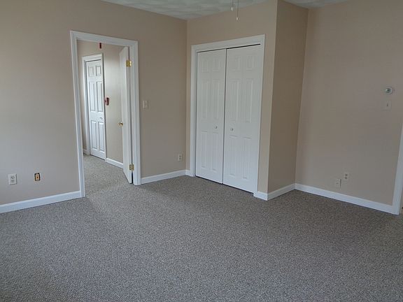 Living Room continued shows a closet and the door next to it is another bedroom. NO wall mounted TV's allowed. NO additional wall mounted shelving allowed.