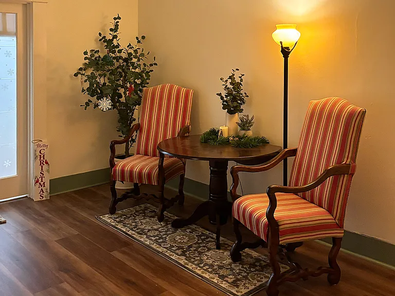 Furnished, shared lobby area with view of neighboring apartment front door (#309A) in background.