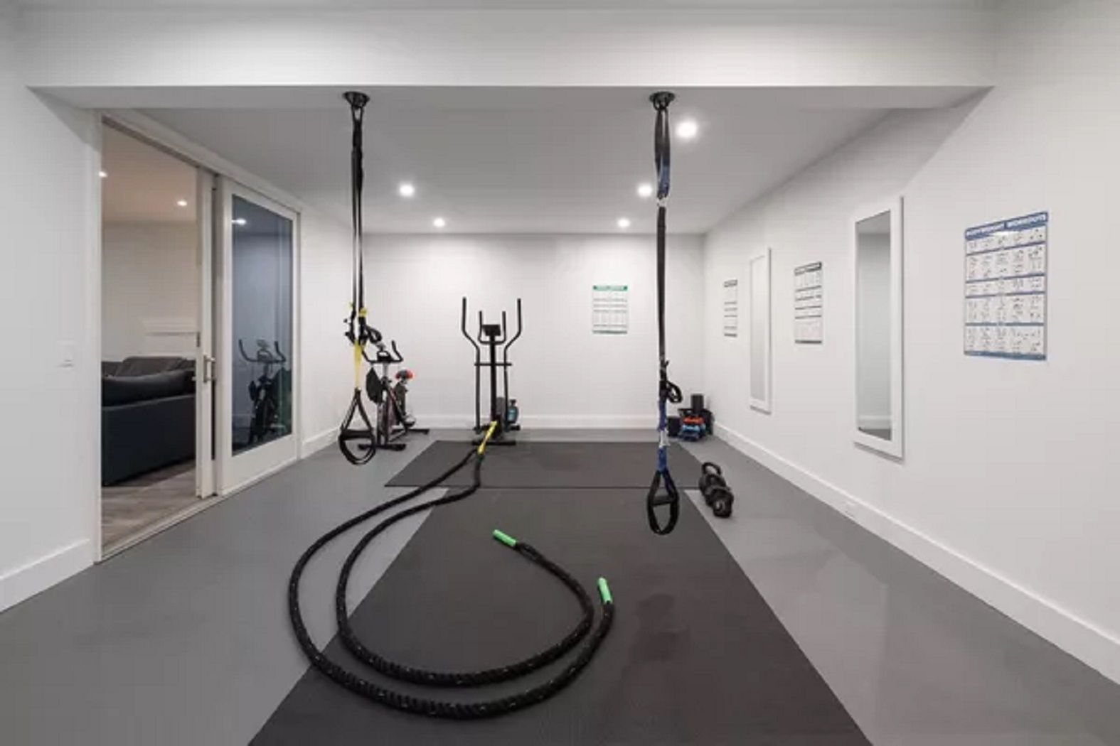 Fitness center located on lower level with cardio, free weights and TRX equipment