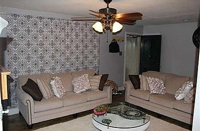 Family Room. Spacious open floor plan, perfect for get togethers and family bonding. The two pillars separate the kitchen/ dining room from the living room.