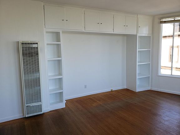 Built-in shelving and cabinetry in the living/dining.