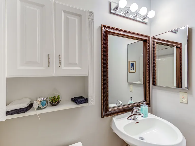 Experience luxury and comfort in our apartment bathrooms, complete with modern vanities, large mirrors, and high-quality fixtures for a relaxing and refreshing environment.