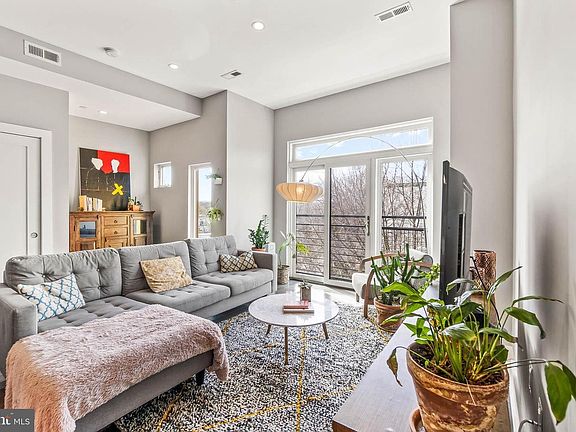 Another way to stage the living room. You can see a large closet and an alcove for extra storage, or a cozy nook for reading/lounging.