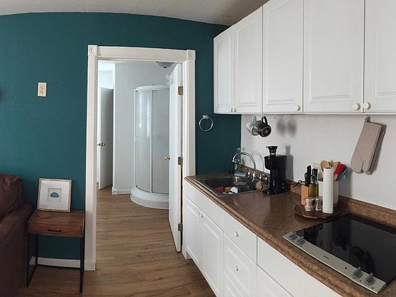 kitchen area, good storage and counter space! comes with coffee maker, stove top, sink, microwave and fridge!