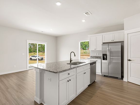The kitchen overlooks the dining area