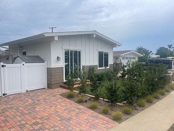 entrance to apartment and side yard access vinyl gate
